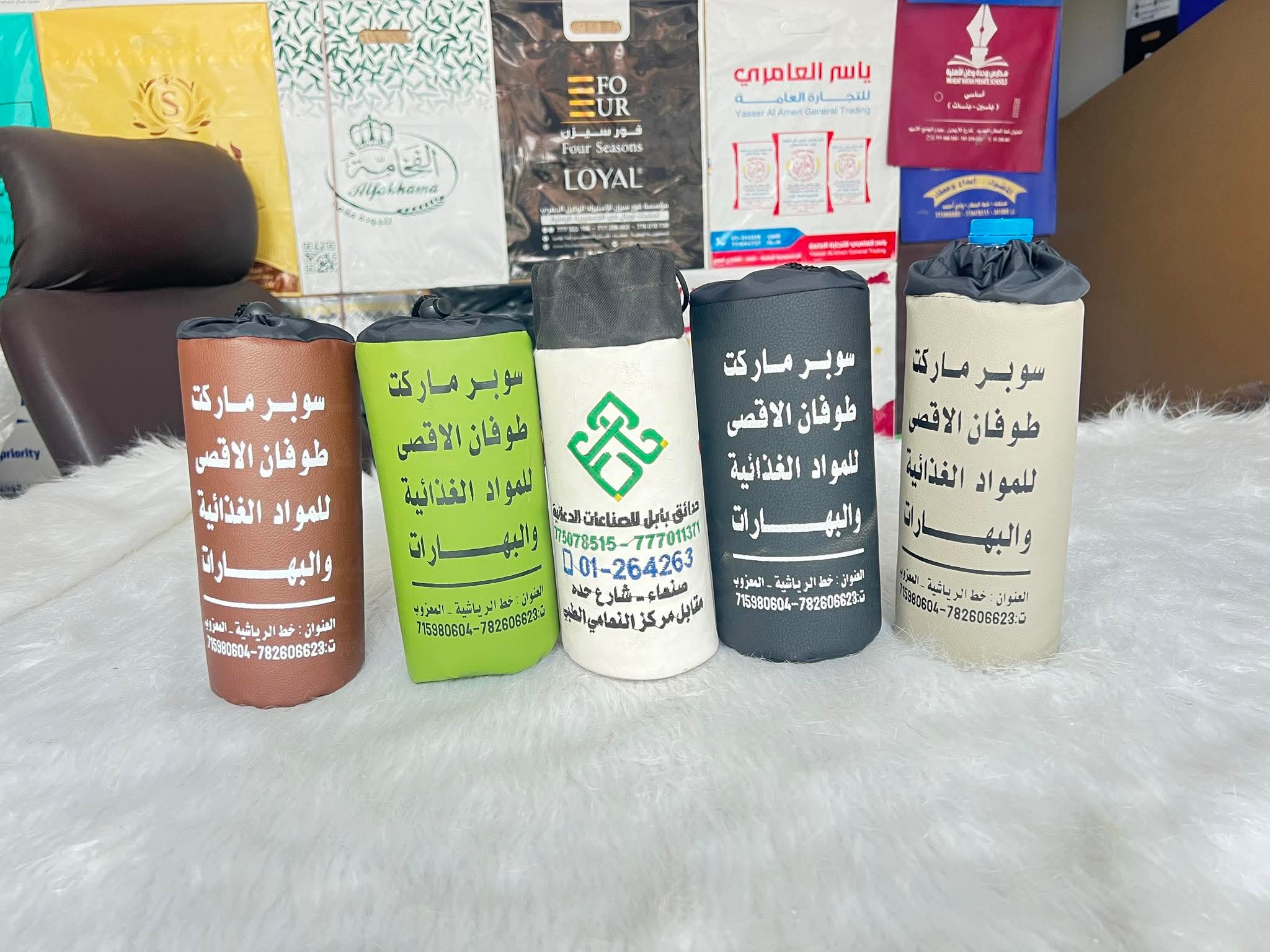 حافظات ماء مطرزه بأسم زبون